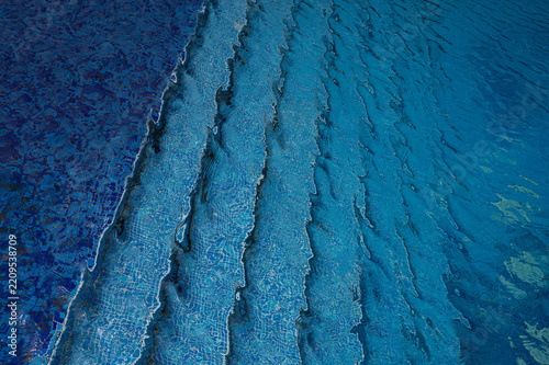 Abstract blue swimming pool water and steps background