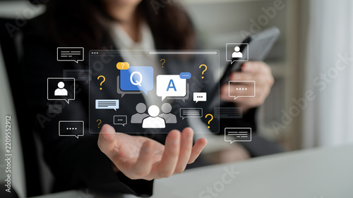 Virtual Interaction Concept with Question and Answer Symbols in a Business Setting Featuring Diverse Communication Elements. Bitwise.