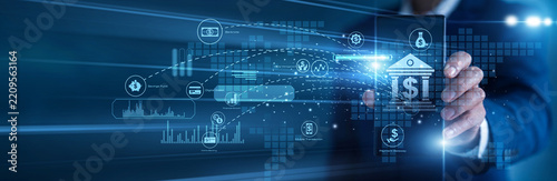 Financial executive working on mobile Banking infrastructures daily. Manager using a tablet analyzing secure transaction volumes and economic growth data charts on a luminous digital screen.