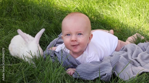 Curious infant exploring the world with rabbit.