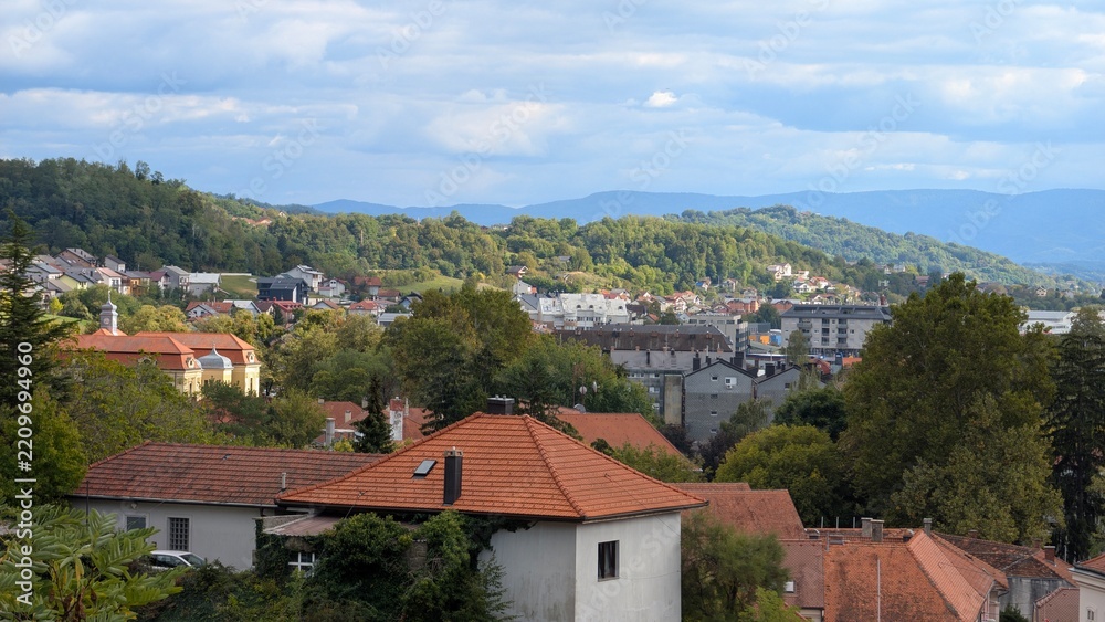 Fototapeta premium Panoramic view over Krapina town rooftops and rolling hills in county Hrvatsko Zagorje Croatia with scenic countryside landscape, travel Europe