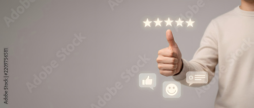 Man giving thumbs up for five star customer satisfaction rating and positive feedback evaluation concept of excellent service quality user experience and business reputation ranking success