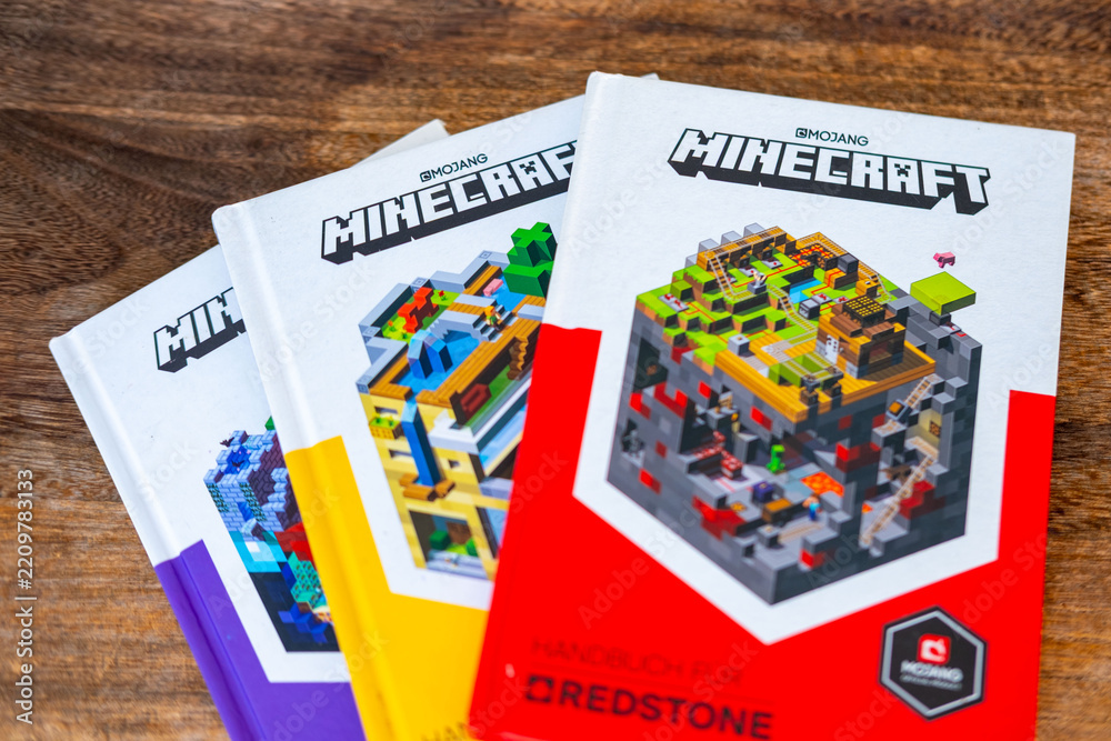 Naklejka premium Minecraft books covers pixel art design, Mojang official merchandise guide books, Collector items for Minecraft fans, Pop culture, gaming literature collector items blocky aesthetic, gaming franchise