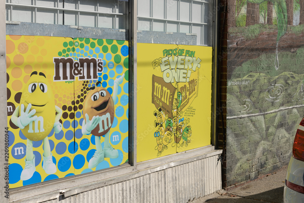 Obraz premium M&Ms candy poster wrap outside Mountain Convenience located at 509 Mount Pleasant Rd, Toronto