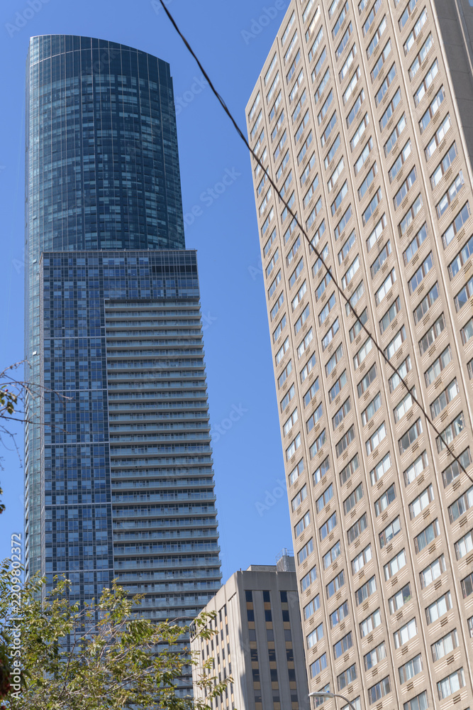 Obraz premium (at right) old apartment and (at left) east elevation of Aura, a mixed-use skyscraper completed in 2014, designed by Graziani + Corazza, located at 386 & 388 Yonge Street (at Gerrard Street), Toronto