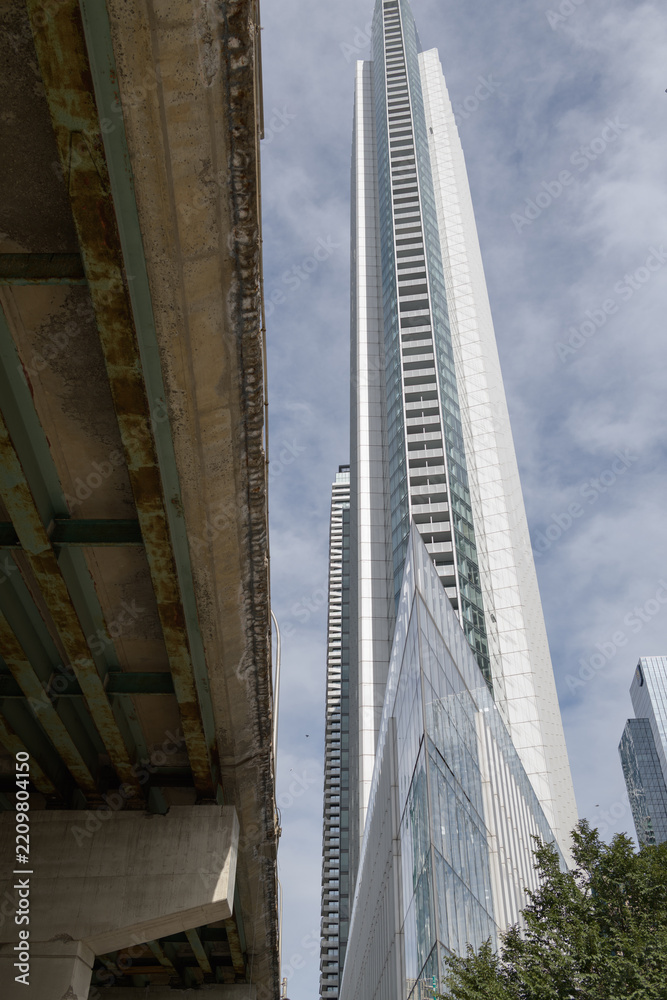Fototapeta premium west elevation of 10 York Street, a condominium complex, with undercroft of elevated Gardiner Expressway, Toronto