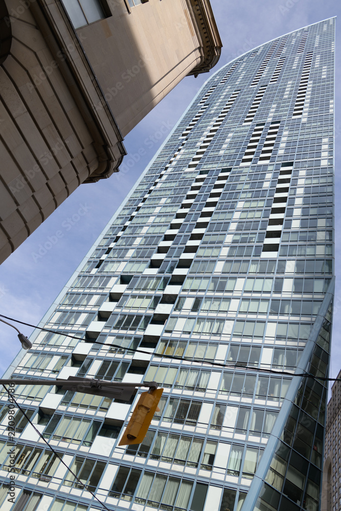 Fototapeta premium detail of west elevation of The L Tower, a residential tower, designed by Daniel Libeskind, located at 8 The Esplanade, Toronto
