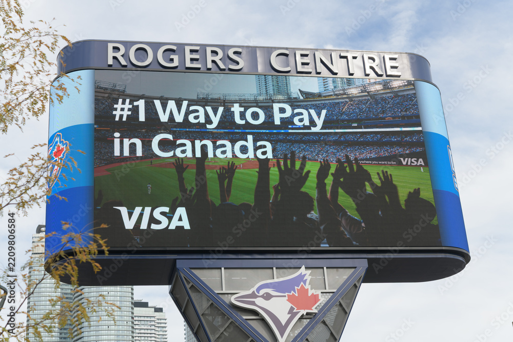 Fototapeta premium Rogers Centre Gardiner Pylon LED sign featuring advertising for VISA, Toronto