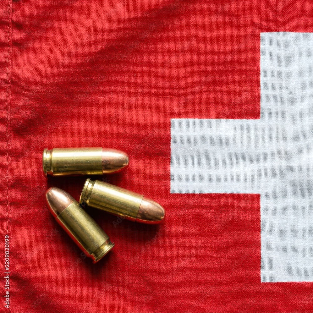 Obraz premium Swiss Flag with Bullets Symbolizing Conflict Security or Military Theme