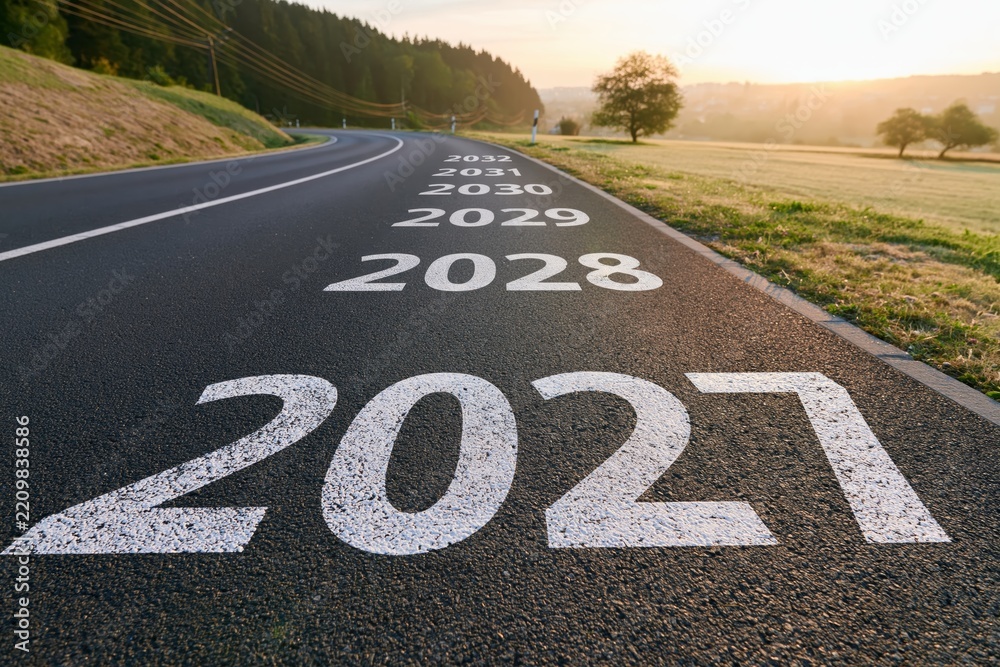 Fototapeta premium 2027 Future road with painted years showing progress and planning as a time line concept for growth vision and strategy