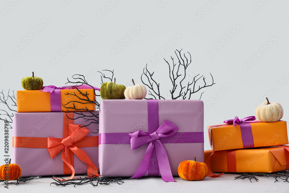 Obraz premium Halloween gift shopping and seasonal celebration, wrapped presents with velvet pumpkins and decorative branches for autumn holiday party decoration