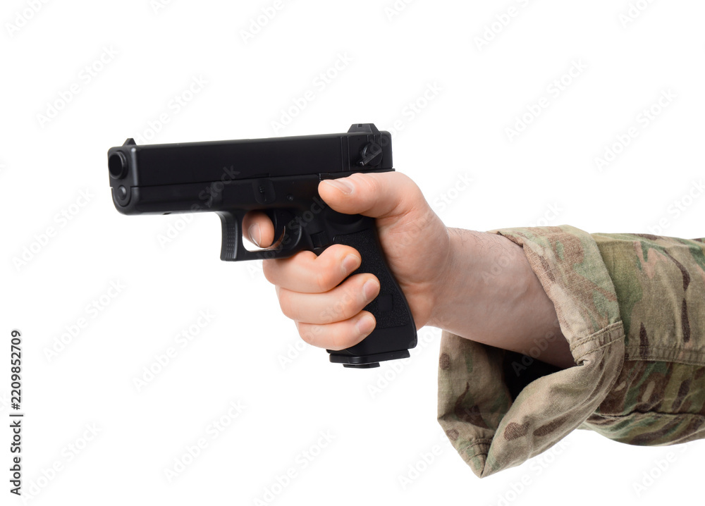 Obraz premium Military defense and combat training, soldier hand holding a black semi-automatic pistol for tactical security and law enforcement operations