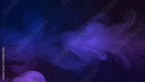 Abstract background with swirling blue and purple smoke clouds.