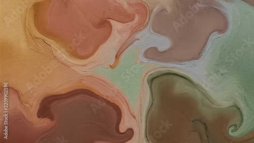 Abstract swirling fluid paint art with earthy tones and organic shapes