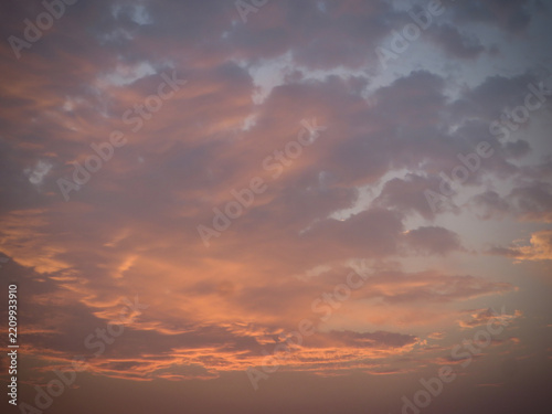 Beautiful Peach and Lavender Sunset Clouds Stretching Across a Soft Blue Evening Sky with Delicate Layers of Golden Twilight Light on West Lake in Hanoi, Vietnam