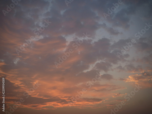 Soft Peach and Lavender Sunset Clouds Glowing Across a Dreamy Evening Sky with Warm Orange Twilight Colors on West Lake in Hanoi, Vietnam