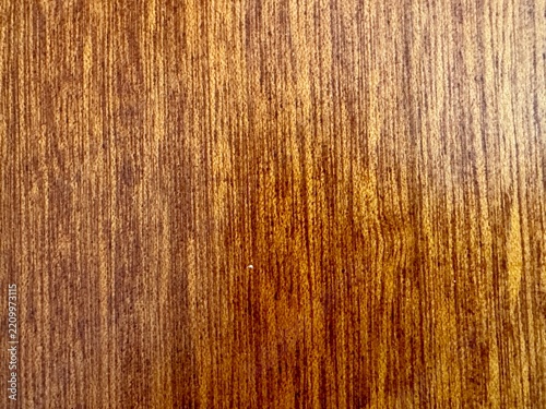 Fotografie Close up brown wooden surface texture background with fine vertical grain