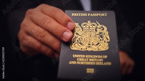 British Passport Held In Hand Close Up