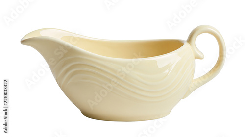 Obraz na plátně Cream colored ceramic gravy boat with wavy embossed texture and curved handle