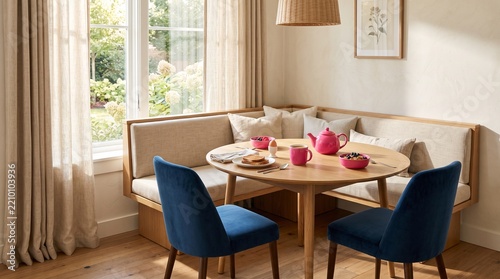 Cozy Dining Area with Round Wooden Table Blue Velvet Chairs Natural Light