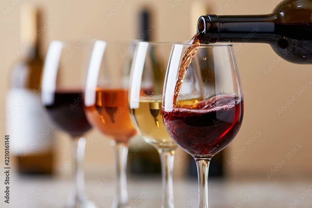 Obraz premium The Red Wine Glass Pouring Scene at a Sophisticated Dinner