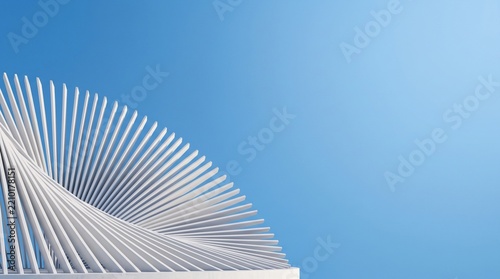 Obraz na plátně White spiral architectural slats rising against a clear blue sky background