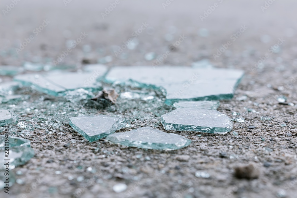 Obraz premium The Broken Glass Shards on the Street Create a Quiet Hazard and Texture