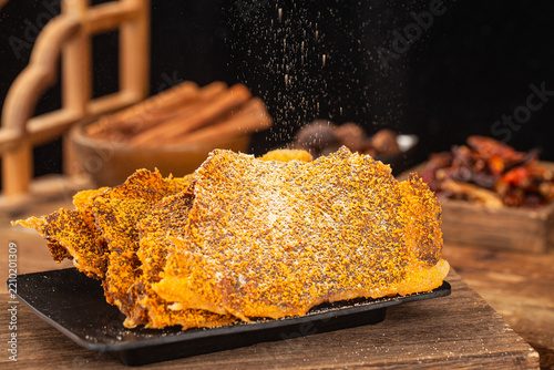 Dried beef crisps, beef crisps on a wooden background