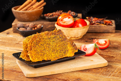 Dried beef crisps, beef crisps on a wooden background