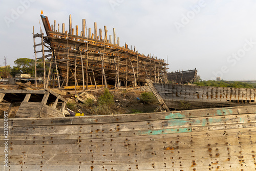 Dhow shipyard with hulls under construction, Mandvi, India