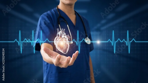 Doctor in blue scrubs holding a glowing 3 d human heart model with ekg pulse line background