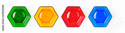 Colorful hexagonal glass shapes isolated on white background. Abstract geometric composition with red, blue, green and yellow transparent forms