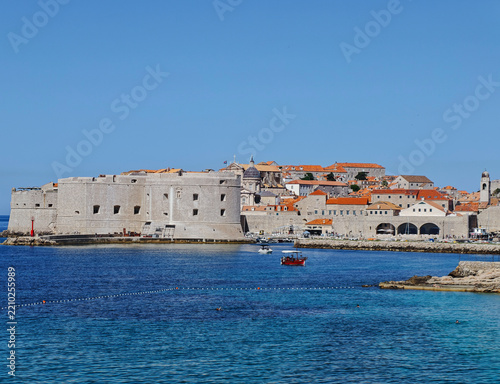 Majestic St. John's Fortress standing proudly by the tranquil blue Adriatic Sea under a clear sky.