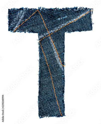 A letter of the alphabet cut out of a piece of denim fabric on a white background. Letters isolated