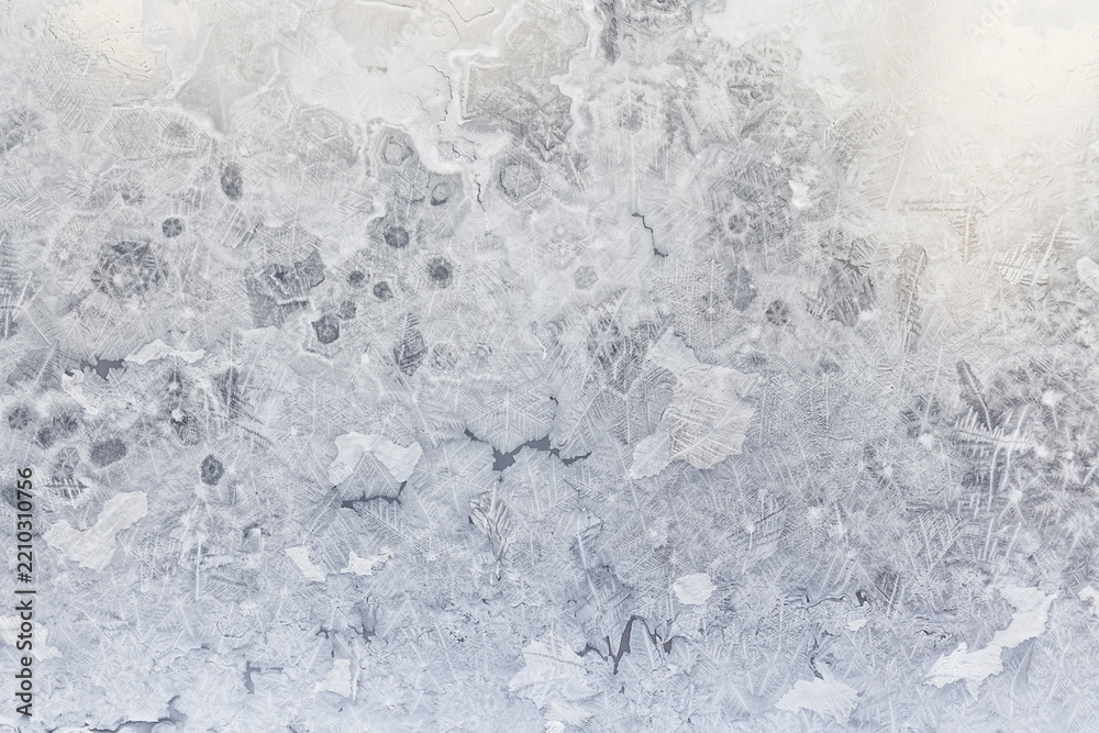 Fototapeta premium ice pattern on winter glass, abstract background on a cold sunny day