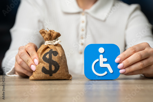Symbol of a person with a disability and a dollar money bag. Cash benefits and social payments. Budget line item for supporting vulnerable groups.