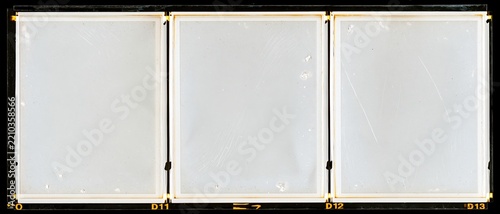 Three blank overexposed medium format film frames arranged in a row on a contact sheet