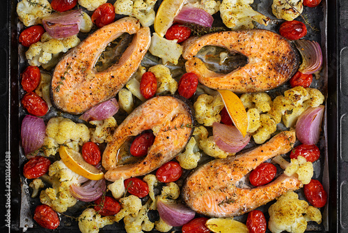 Oven Roasted Salmon with Vegetables and Lemon Top View. texture