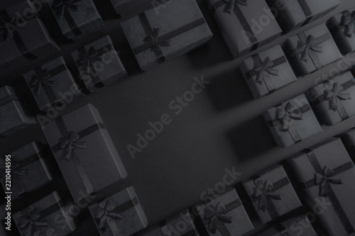 Black Friday Gift Boxes with Black Ribbons on Dark Background