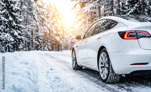 White Car on country winter road covered with snow close-up