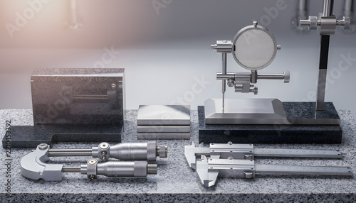 Precision measuring instruments and calibrated tools arranged for industrial quality check