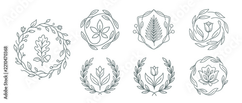 Set of elegant botanical emblems and floral wreaths isolated