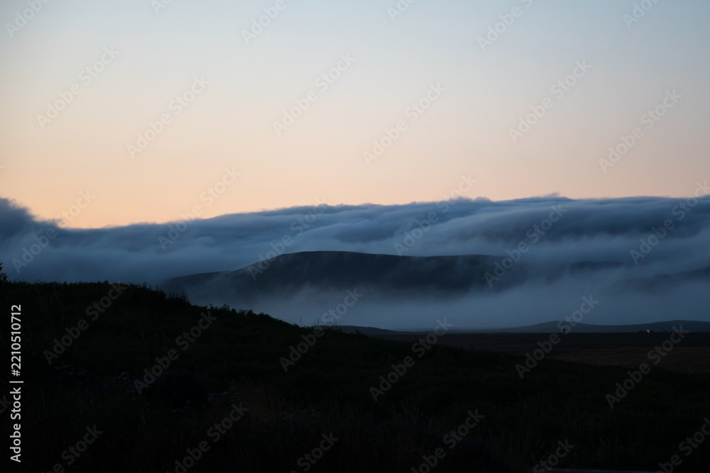 Obraz premium Misty Icelandic Mountains and Rural Landscape