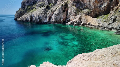 Mali Bok Beach on Cres Island, Croatia. Hidden cove with turquoise Adriatic Sea, dramatic limestone cliffs and crystal water surrounded by unspoiled Mediterranean nature in Cres Island of Croatia