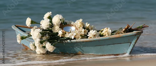 Panel kuchenny z motywem Poetic ritual offering scene weathered turquoise boat filled with white carnations, jasmine, and a golden mirror resting at the oceans edge. Ideal for spirituality, ceremony, and cultural.
