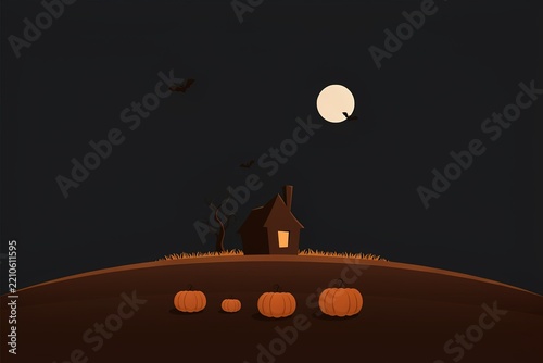 Haunted house with pumpkins under a full moon