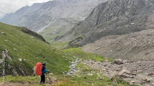 Hiking in Tian Shan Mountains of Kyrgyzstan with stunning views and a clear stream