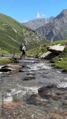 Hiking in Tian Shan Mountains of Kyrgyzstan with a river crossing