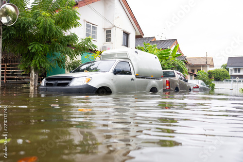 Cars submerged in water. Street after heavy rain. Disaster Motor Vehicle Insurance Claim, Severe weather