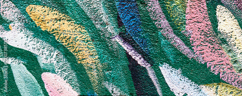 Colorful Abstract Leaf Pattern on Textured Green Wall